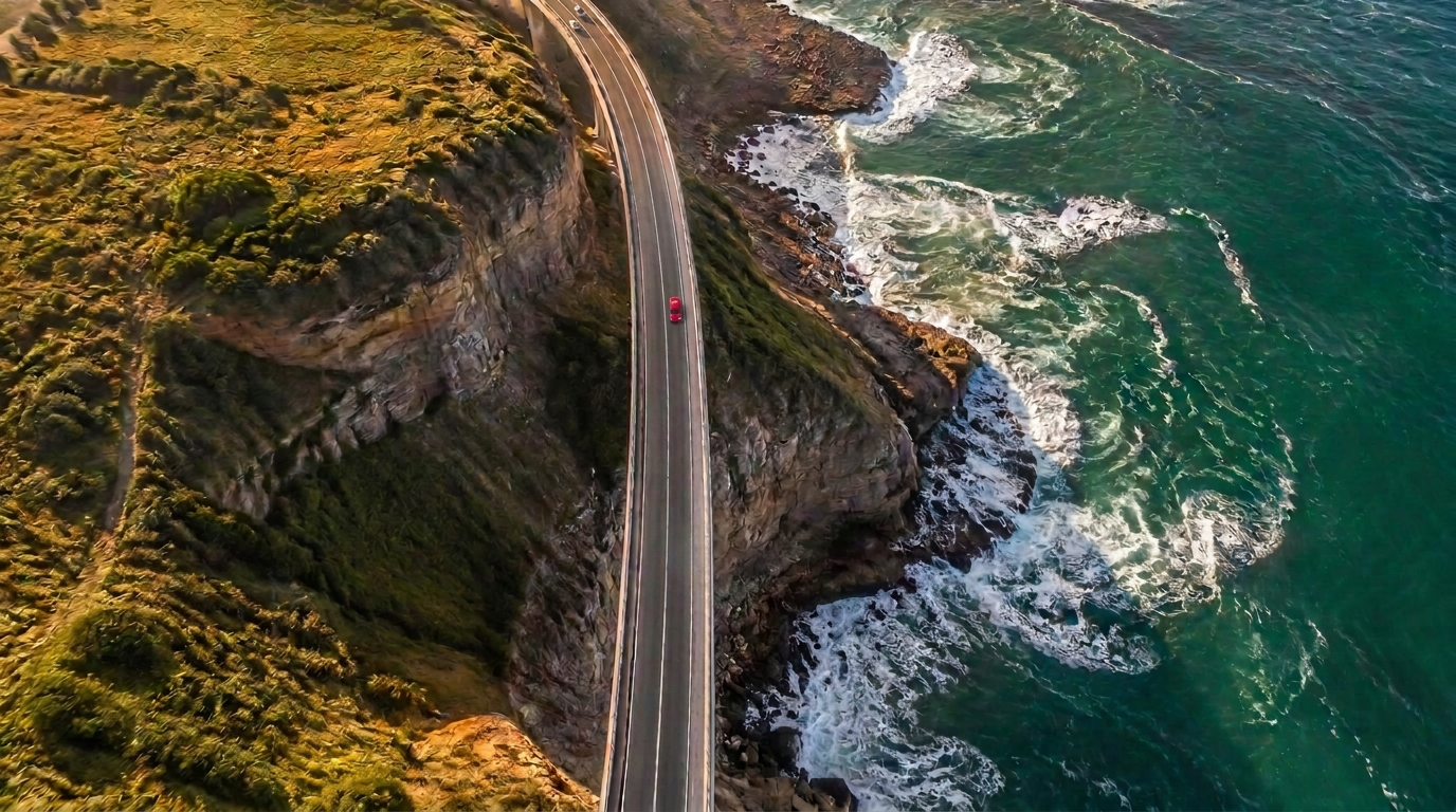 Aerial view of a coastal road beside the ocean